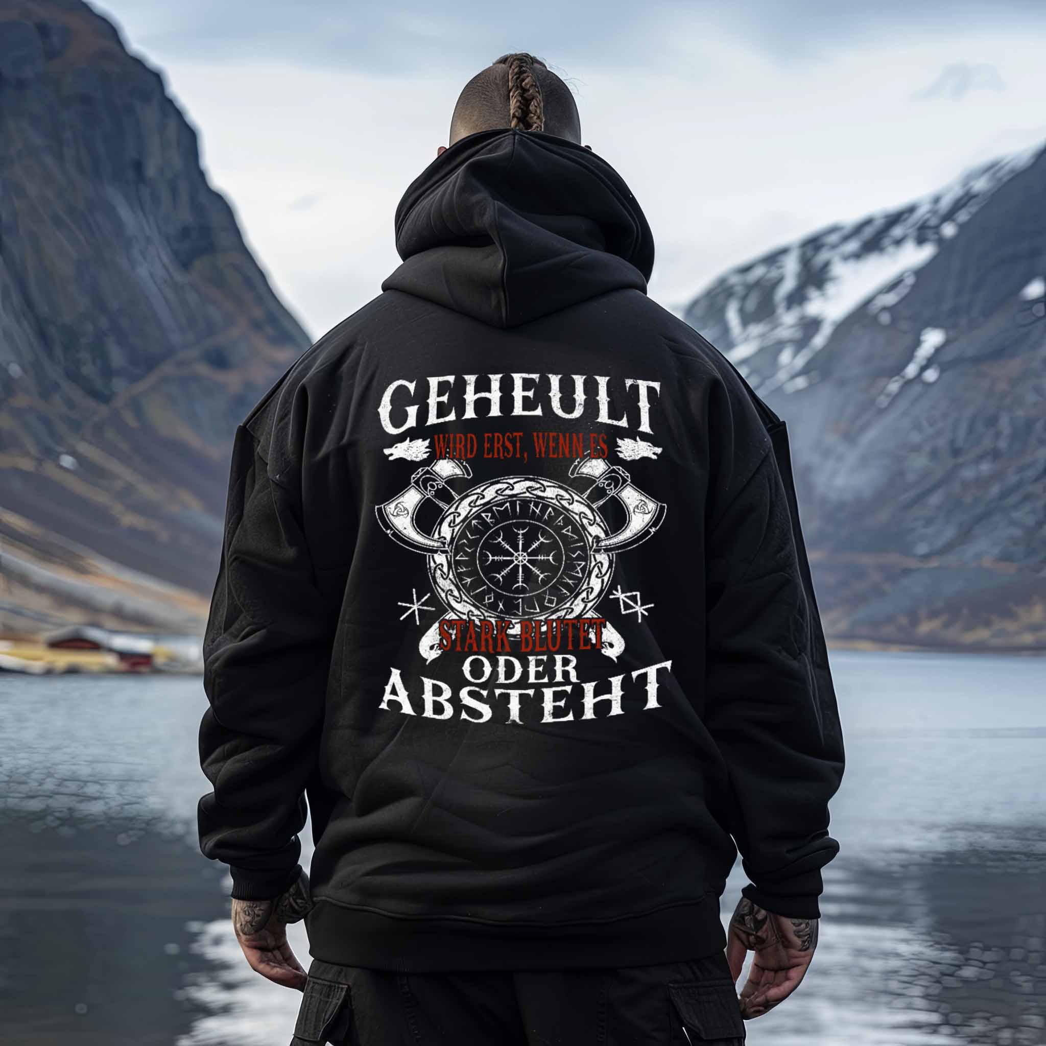 Viking humor oversized hoodie with Helm of Awe symbol and funny quote design, worn near a picturesque mountain and lake background